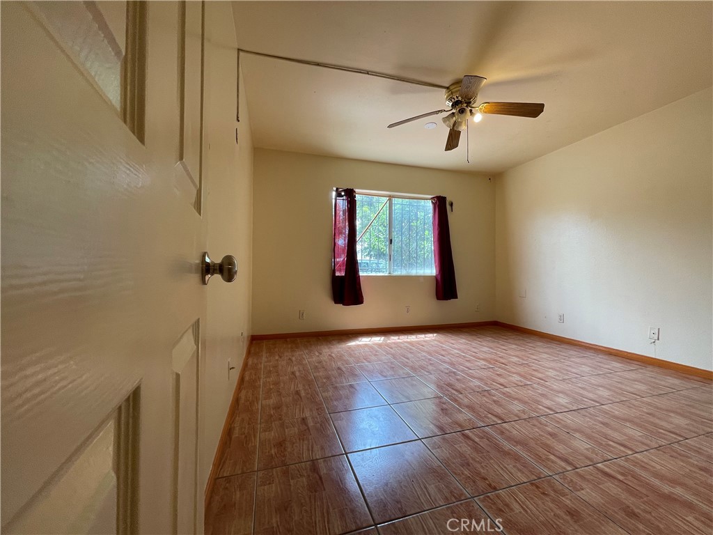 1349 Walnut Avenue Long Beach, CA 90813 - Photo 6 of 13 a view of a livingroom with a ceiling fan and window