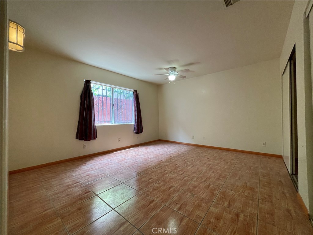 1349 Walnut Avenue Long Beach, CA 90813 - Photo 7 of 13 a view of an empty room with window and chandelier fan