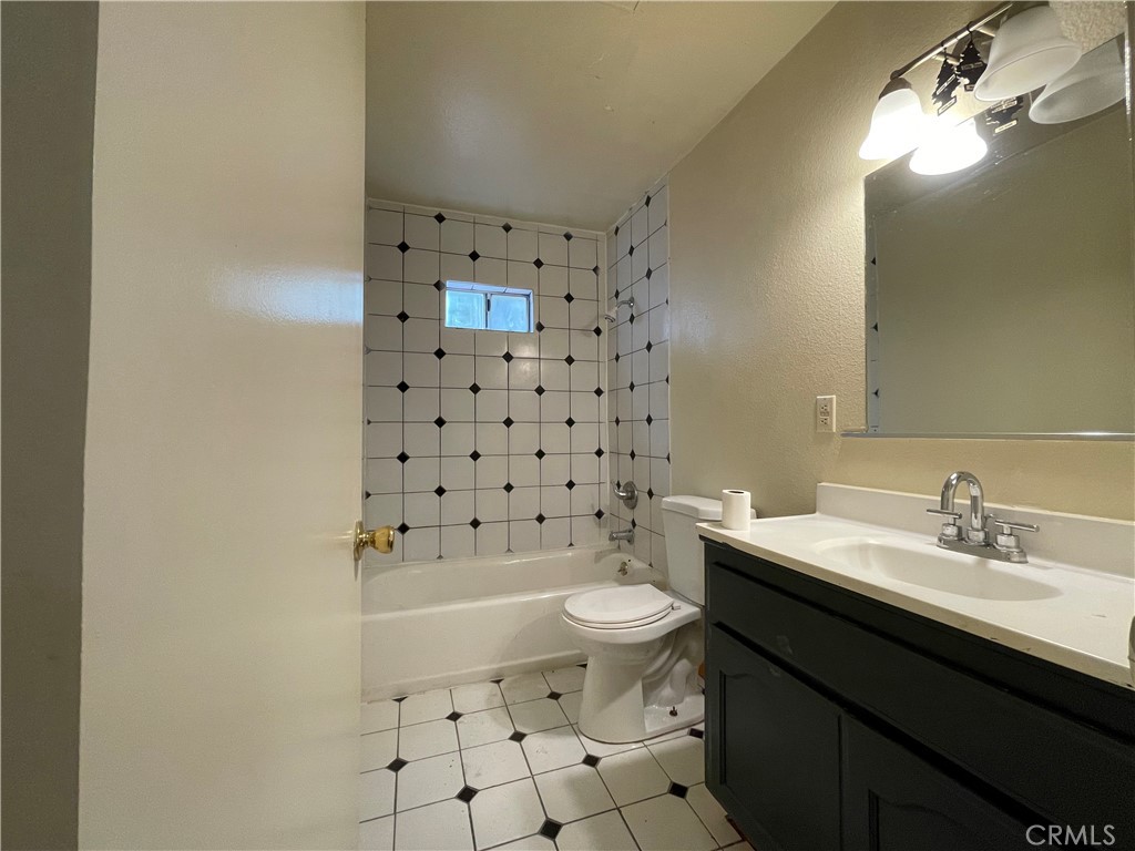 1349 Walnut Avenue Long Beach, CA 90813 - Photo 9 of 13 a bathroom with a sink a toilet and shower