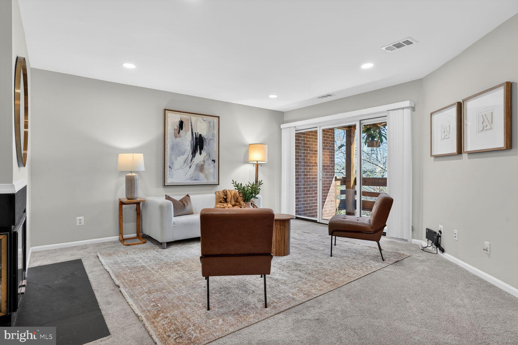 11116 Beaver Trail Court, Unit 11116 Reston, VA 20191 - Photo 5 of 18 Living area with sliding door to balcony