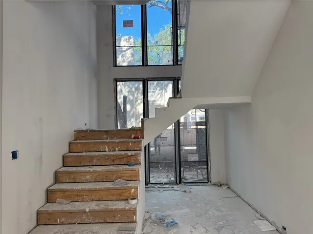 a view of a livingroom with wooden floor and window