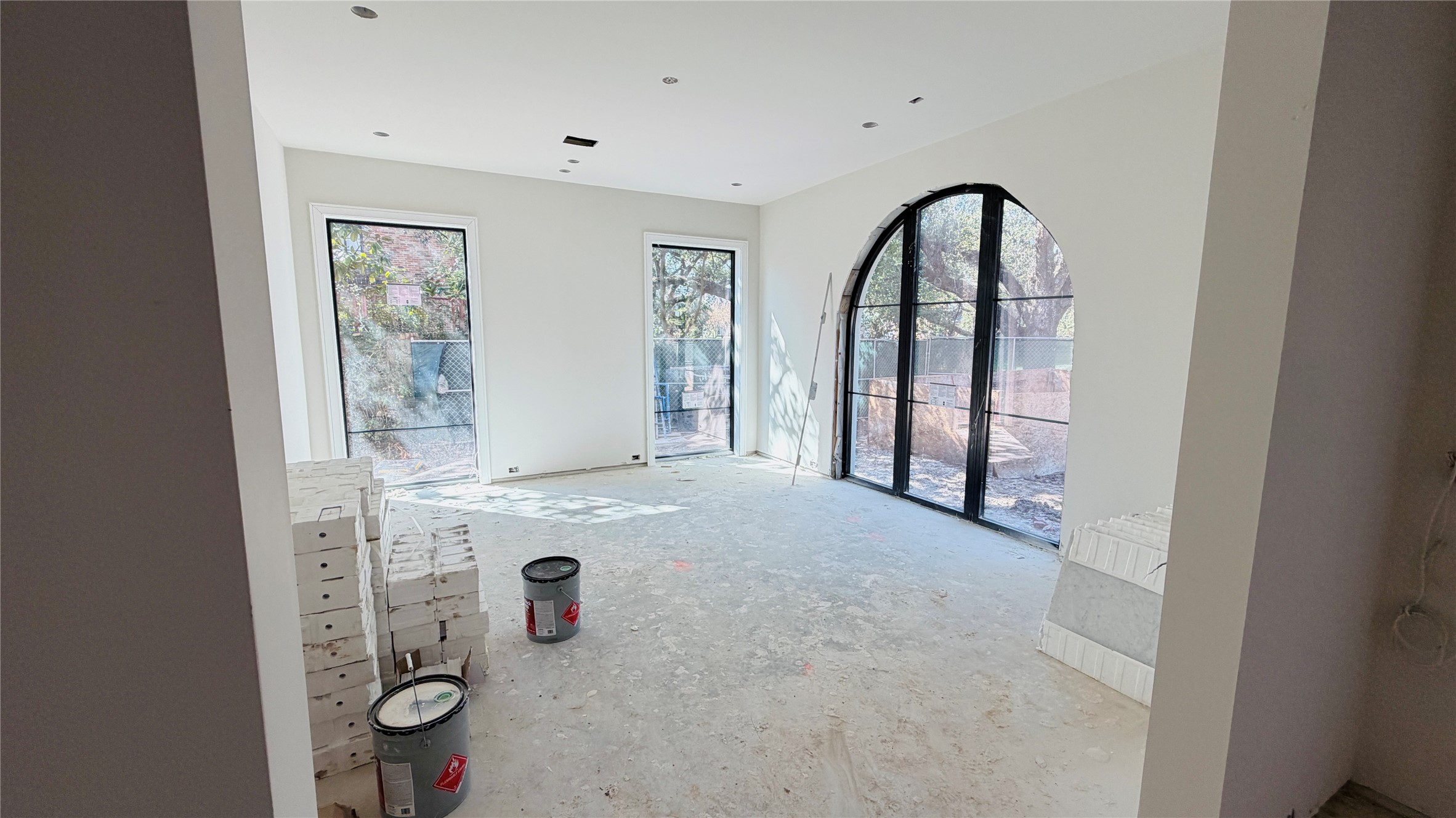 2247 Chilton Road Houston, TX 77019 - Photo 4 of 17 2/19/26 Formal dining area featuring high ceilings, abundant natural light, and gallery-style art lighting.