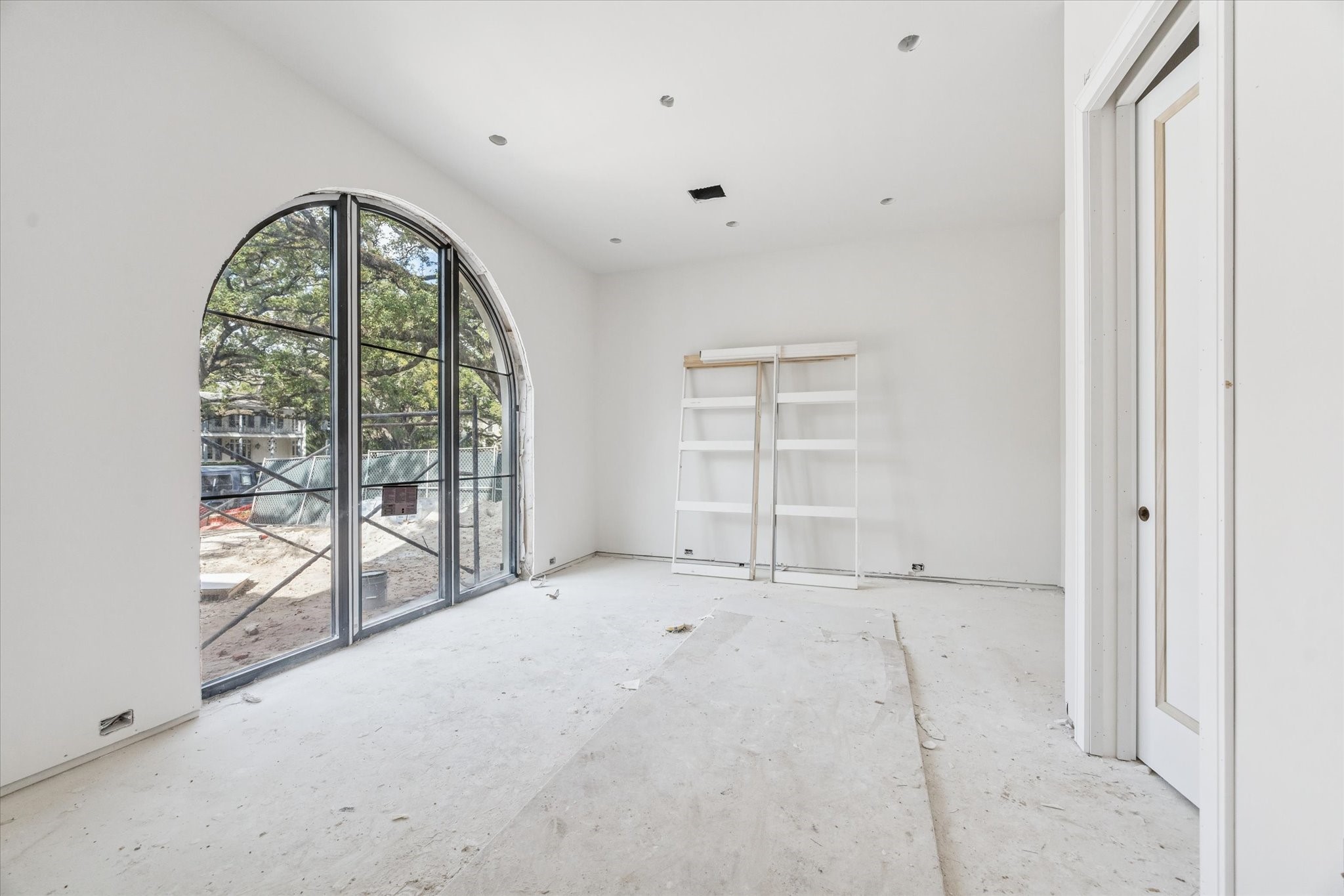 2247 Chilton Road Houston, TX 77019 - Photo 5 of 17 2/19/26 Study or first floor bedroom with grand arched window, full bath and closet.