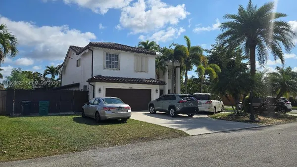 a car parked in front of a house