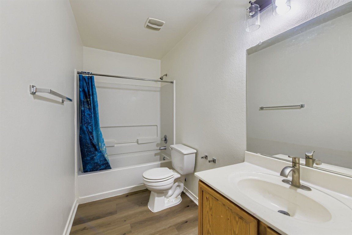 101 Bandara Woods Boulevard Elgin, TX 78621 - Photo 10 of 11 a bathroom with a sink a toilet and shower