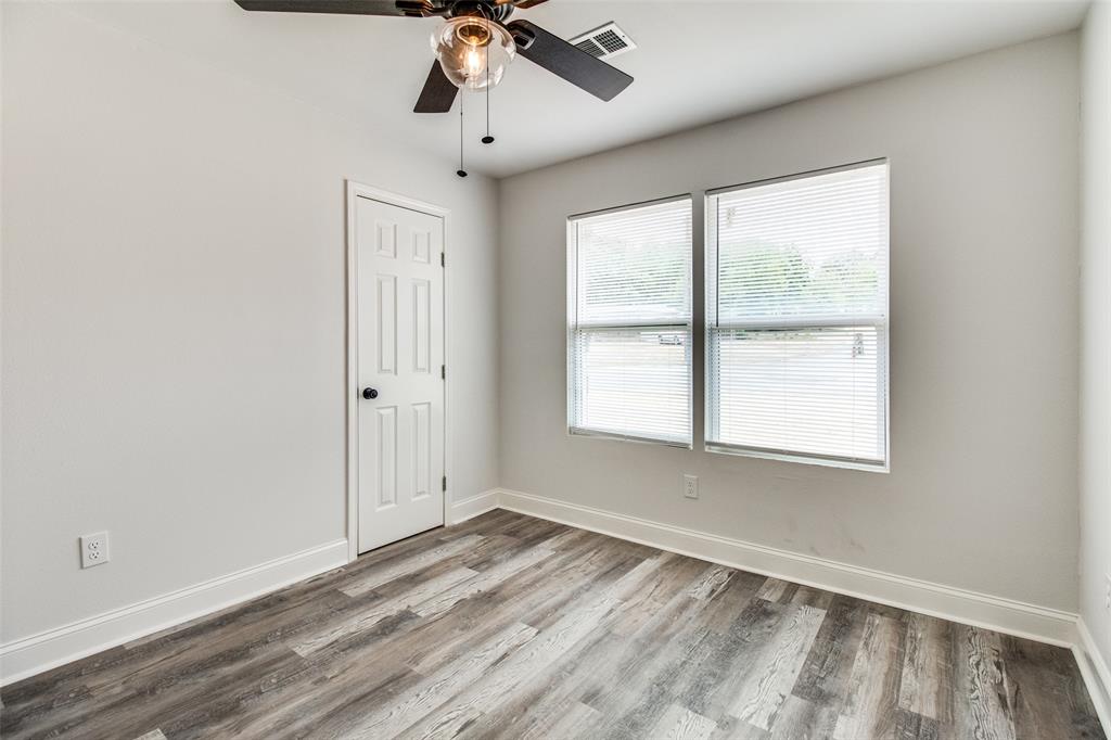 1201 Ridgewood Road Denison, TX 75020 - Photo 23 of 29 Empty room featuring ceiling fan and wood-type flooring
