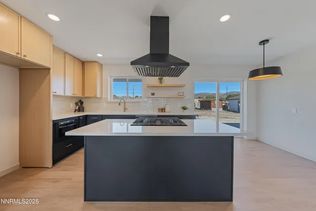a kitchen with a stove a refrigerator and cabinets
