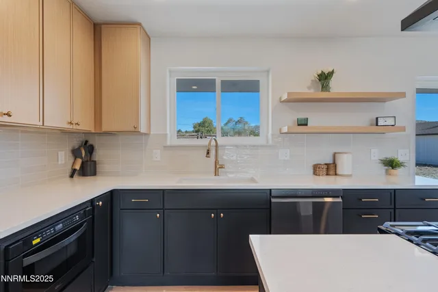 a kitchen with a sink stove and refrigerator