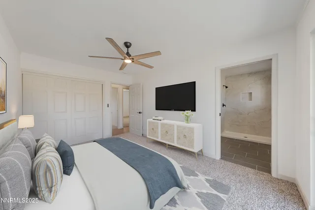 a bathroom with a double vanity sink toilet mirror and shower