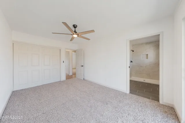 a bathroom with a shower and toilet
