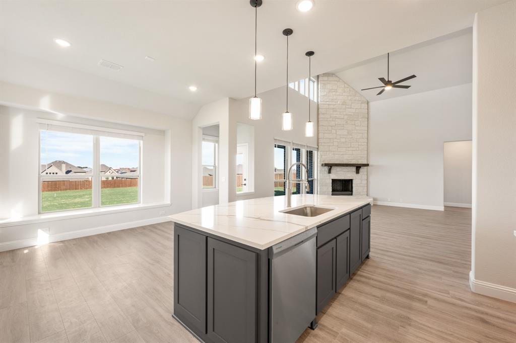 12605 Rocky Top Road Godley, TX 76044 - Photo 21 of 40 a large kitchen with kitchen island a large island in it