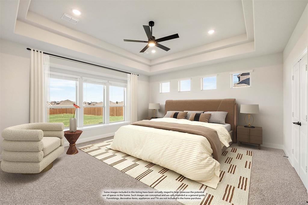 12605 Rocky Top Road Godley, TX 76044 - Photo 23 of 40 a spacious bedroom with a bed couch and a large window