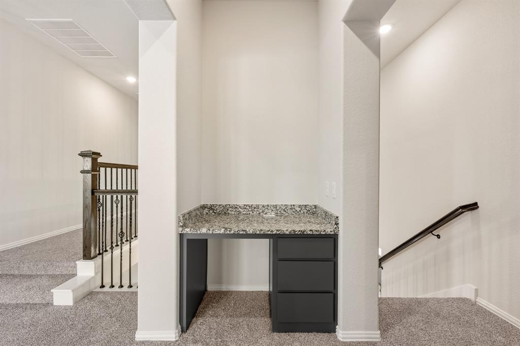 12605 Rocky Top Road Godley, TX 76044 - Photo 28 of 40 a utility room with granite countertop cabinets and utility room