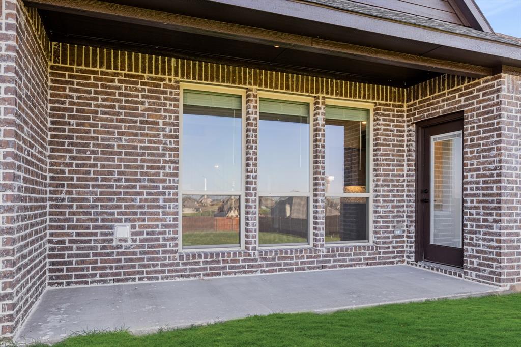 12605 Rocky Top Road Godley, TX 76044 - Photo 37 of 40 a front view of a house with a garden