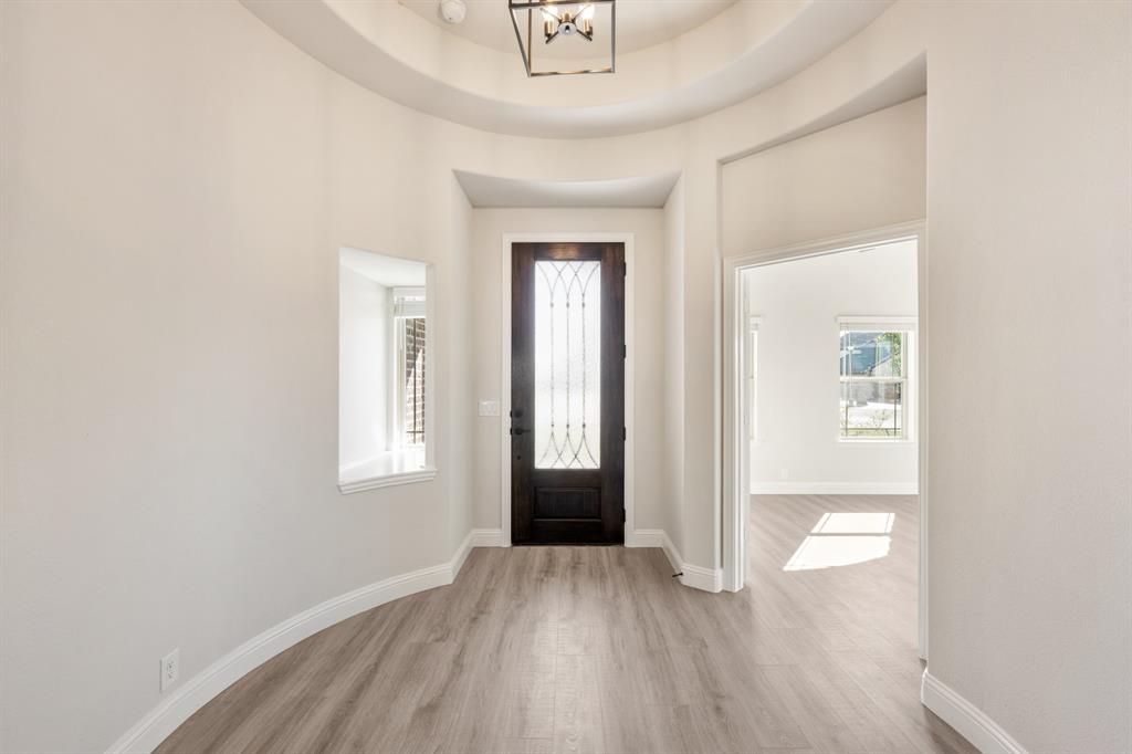 12605 Rocky Top Road Godley, TX 76044 - Photo 4 of 40 an empty room with windows and closet
