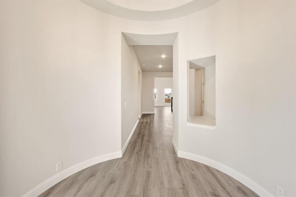 12605 Rocky Top Road Godley, TX 76044 - Photo 7 of 40 a view of a room with wooden floor and a bathroom