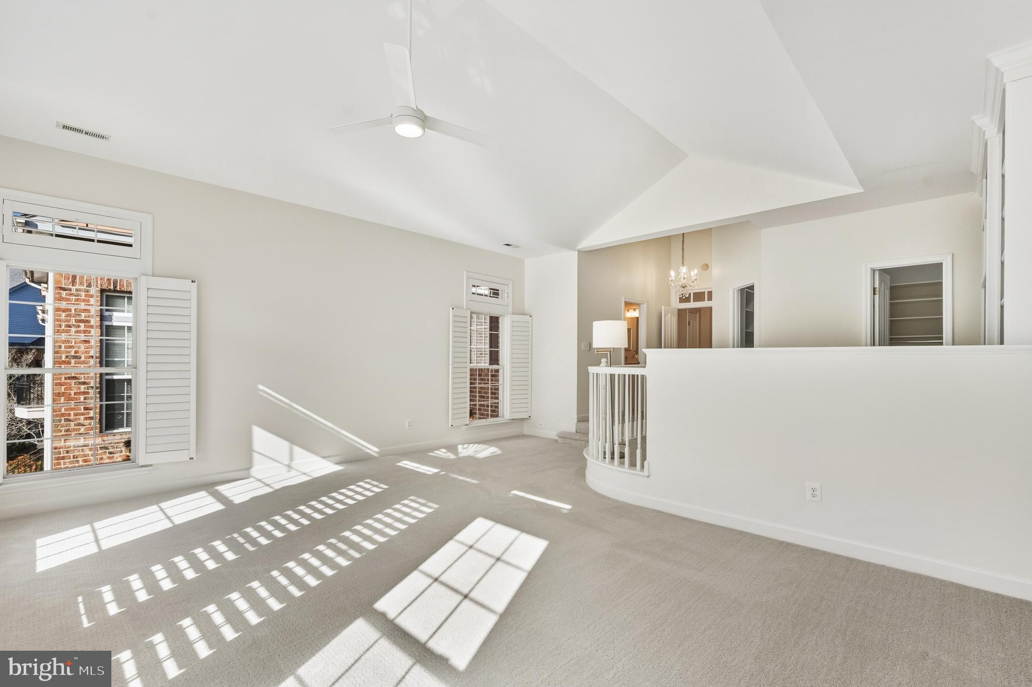1919 Logan Manor Drive Reston, VA 20190 - Photo 12 of 57 a view of an empty room with wooden floor and a window