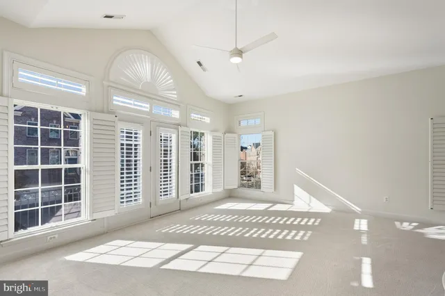 a big room with windows and closet