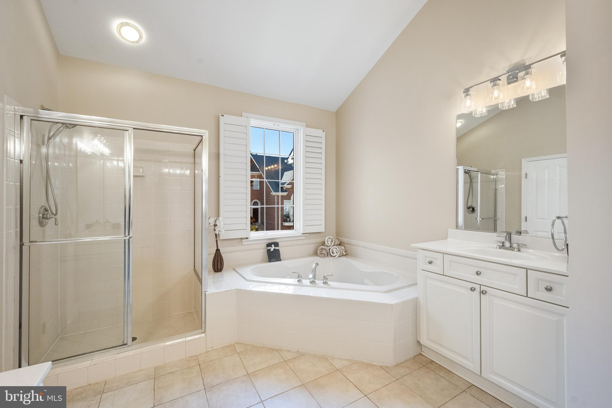 1919 Logan Manor Drive Reston, VA 20190 - Photo 15 of 57 a bathroom with a bathtub a sink and a mirror