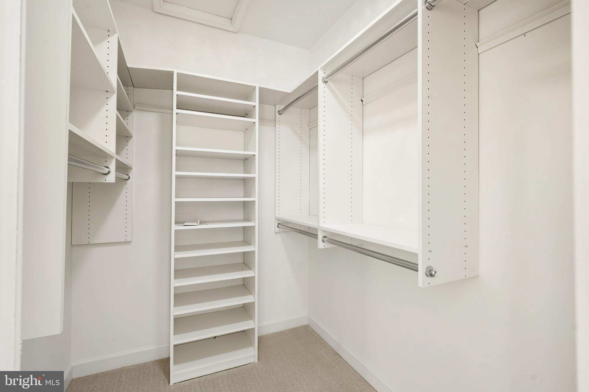 1919 Logan Manor Drive Reston, VA 20190 - Photo 18 of 57 a view of walk in closet with empty racks