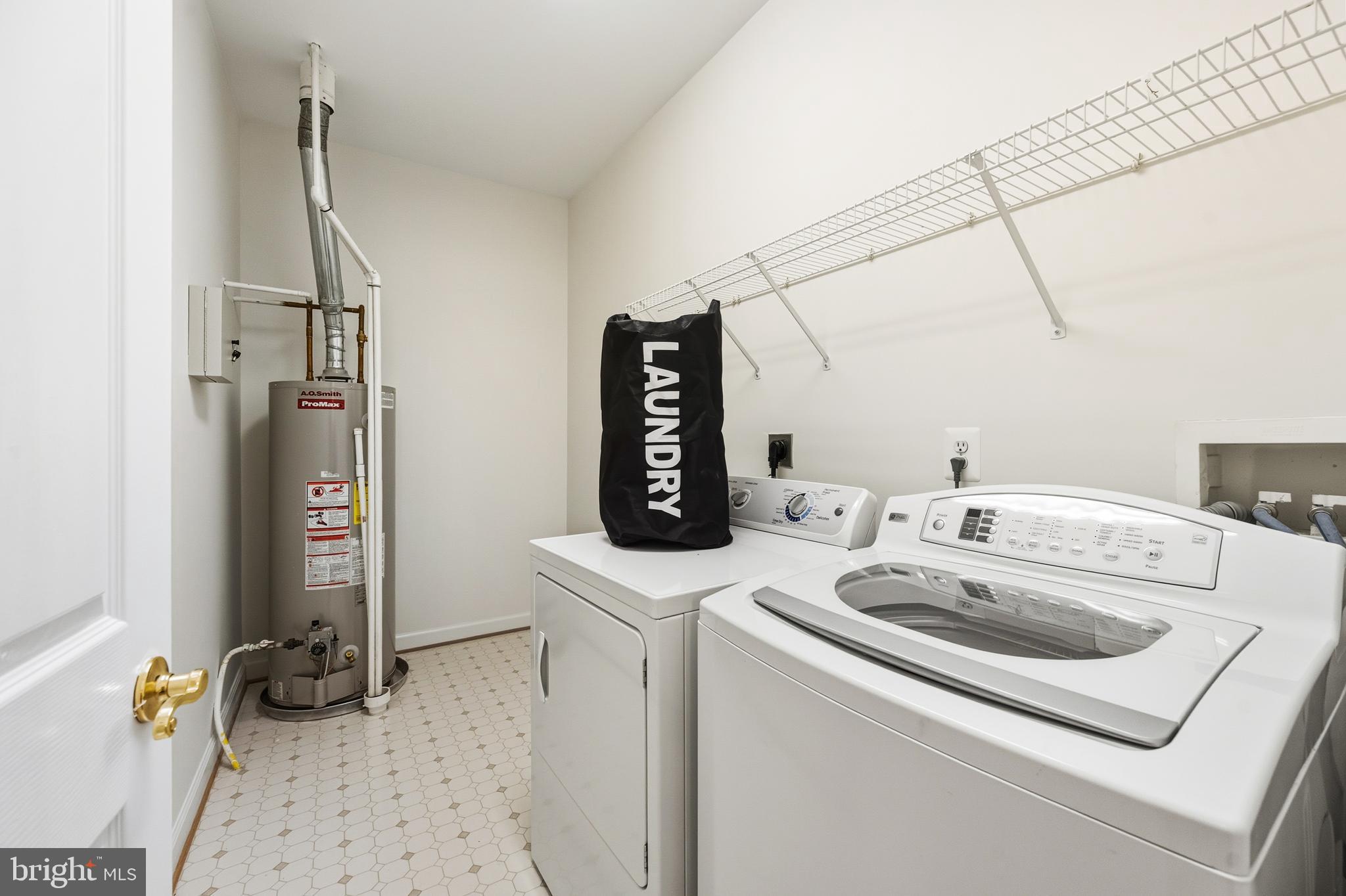 1919 Logan Manor Drive Reston, VA 20190 - Photo 27 of 57 a utility room with dryer and washer