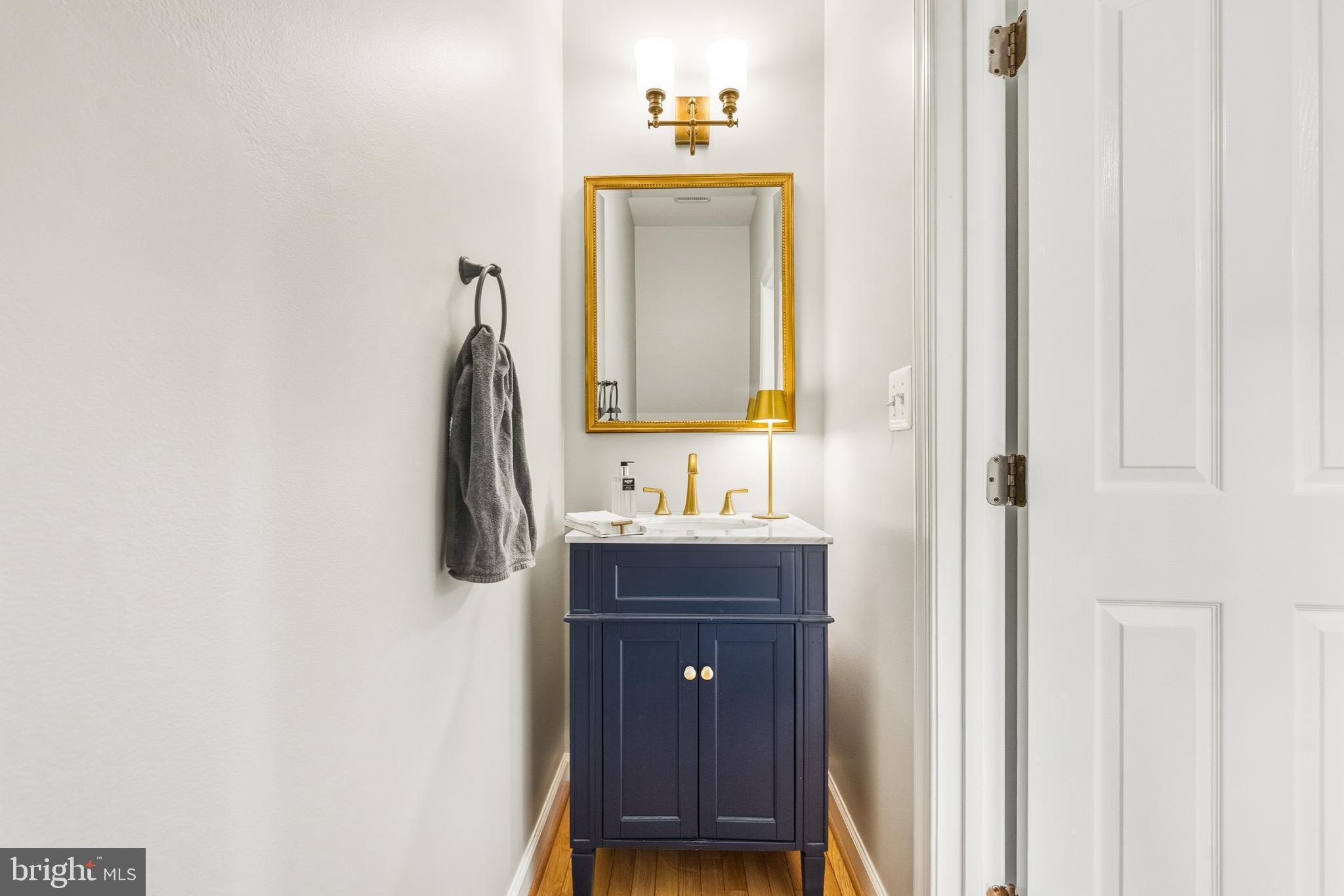 1919 Logan Manor Drive Reston, VA 20190 - Photo 28 of 57 a bathroom with a sink and a mirror