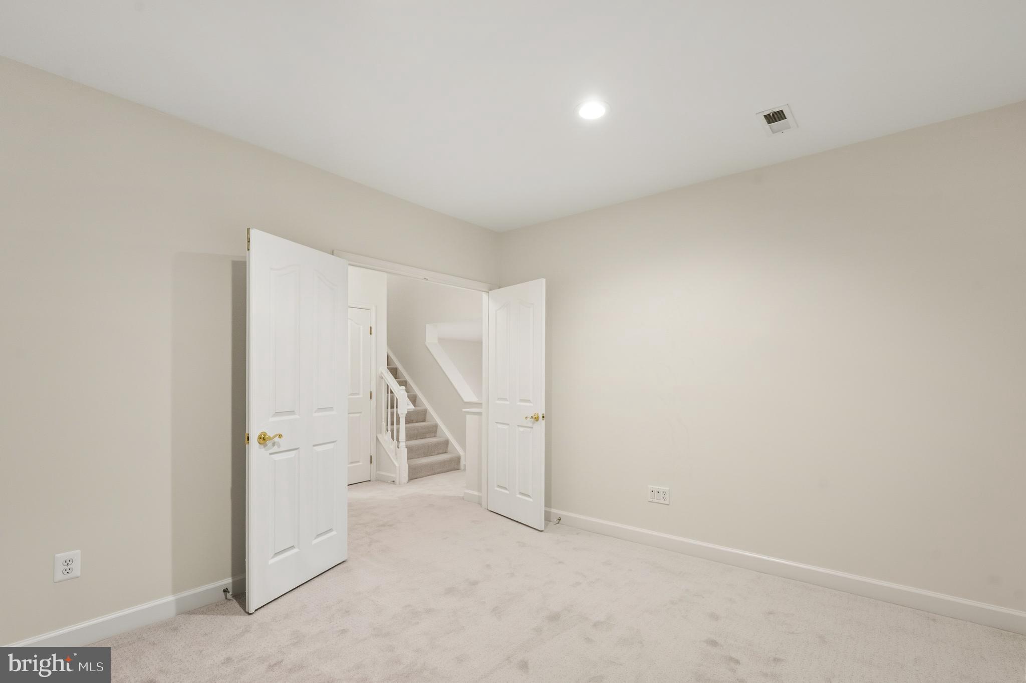 1919 Logan Manor Drive Reston, VA 20190 - Photo 30 of 57 an empty room with a ceiling fan