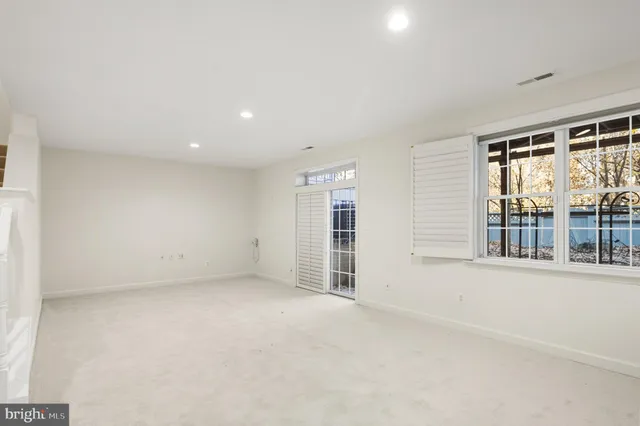 a bathroom with a sink a toilet a mirror and shower curtain