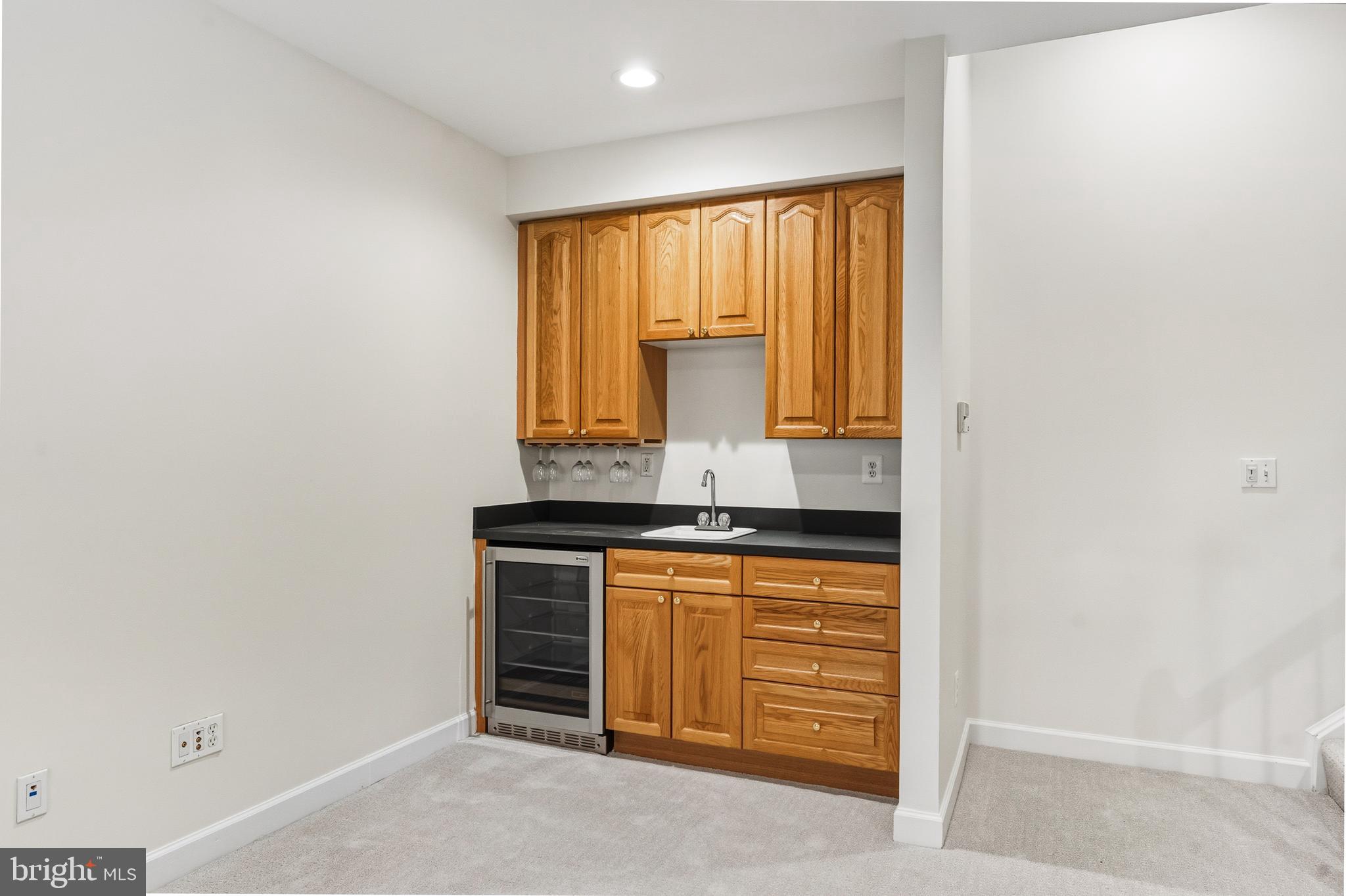 1919 Logan Manor Drive Reston, VA 20190 - Photo 36 of 57 a kitchen with granite countertop cabinets and window