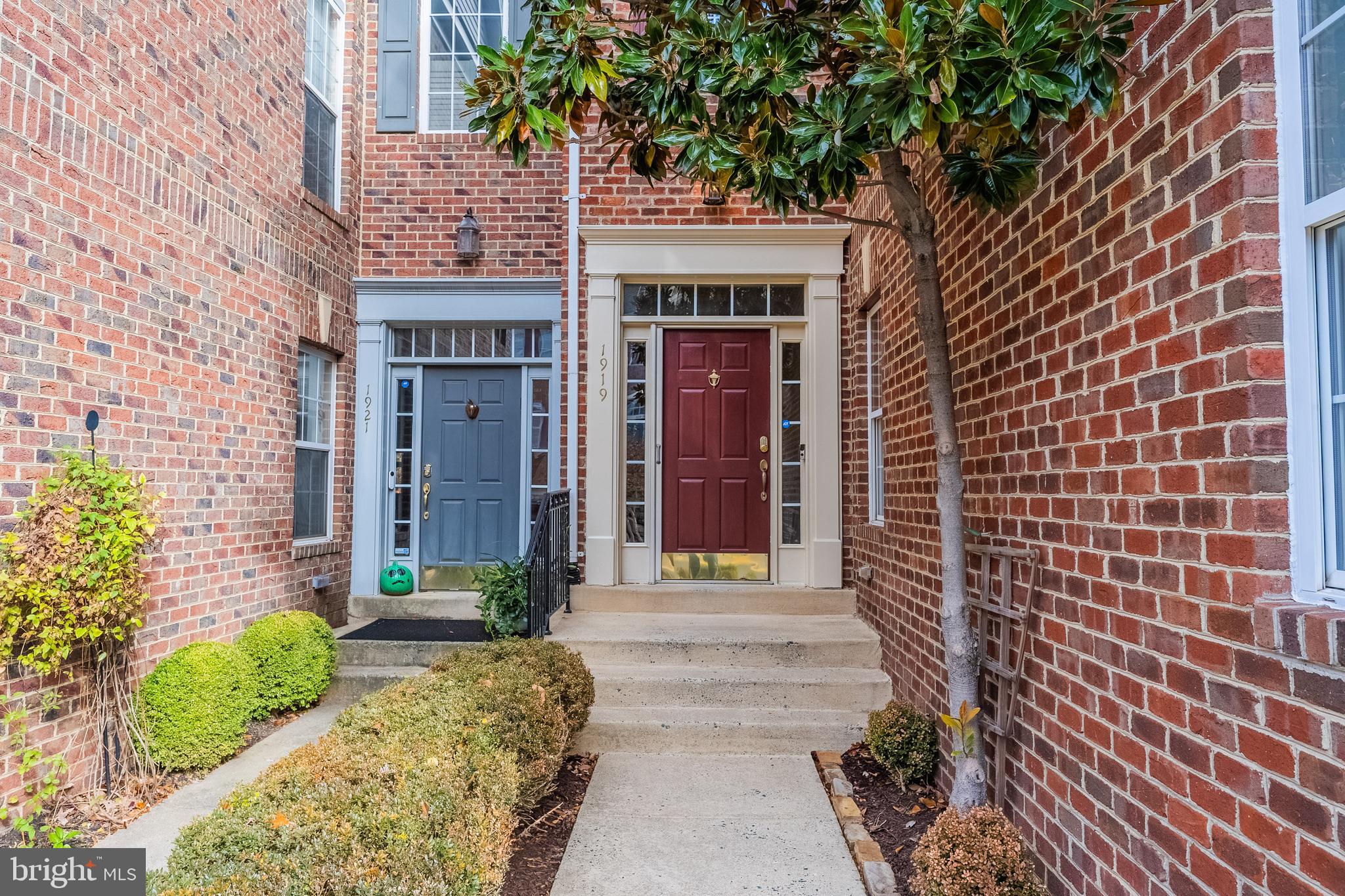 1919 Logan Manor Drive Reston, VA 20190 - Photo 44 of 57 a front view of a building with a garden