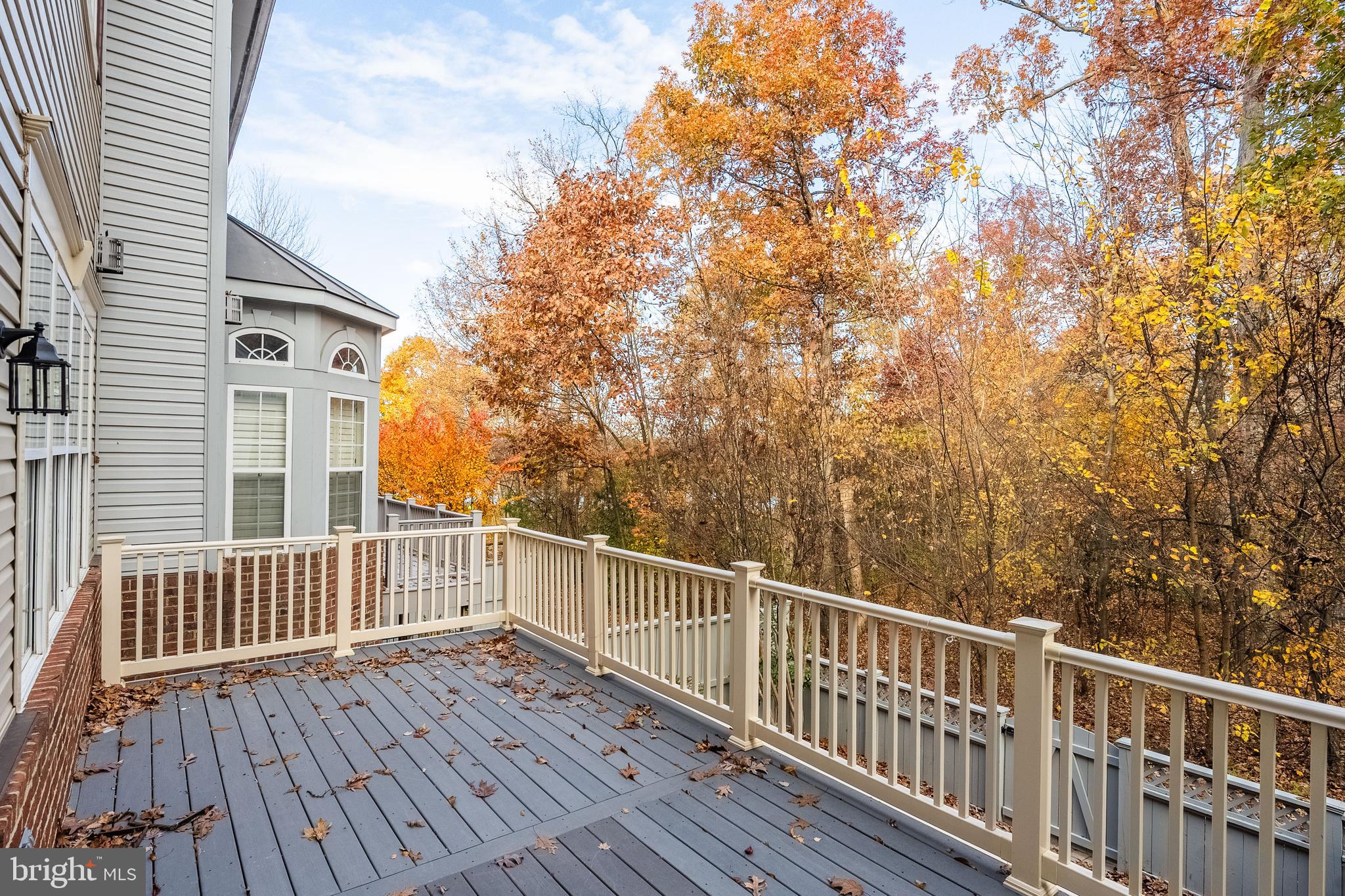 1919 Logan Manor Drive Reston, VA 20190 - Photo 47 of 57 a view of a roof deck with wooden floor and fence