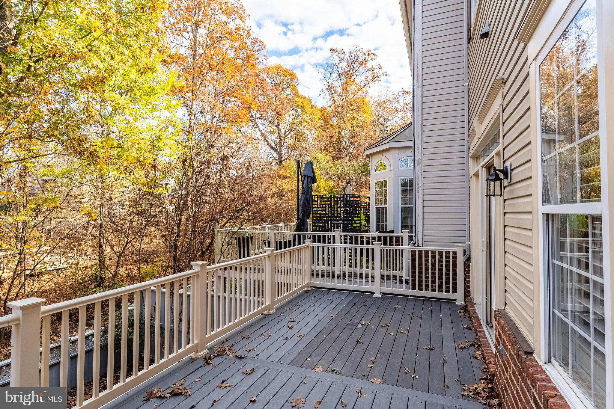 1919 Logan Manor Drive Reston, VA 20190 - Photo 48 of 57 a view of a roof deck with wooden fence and floor