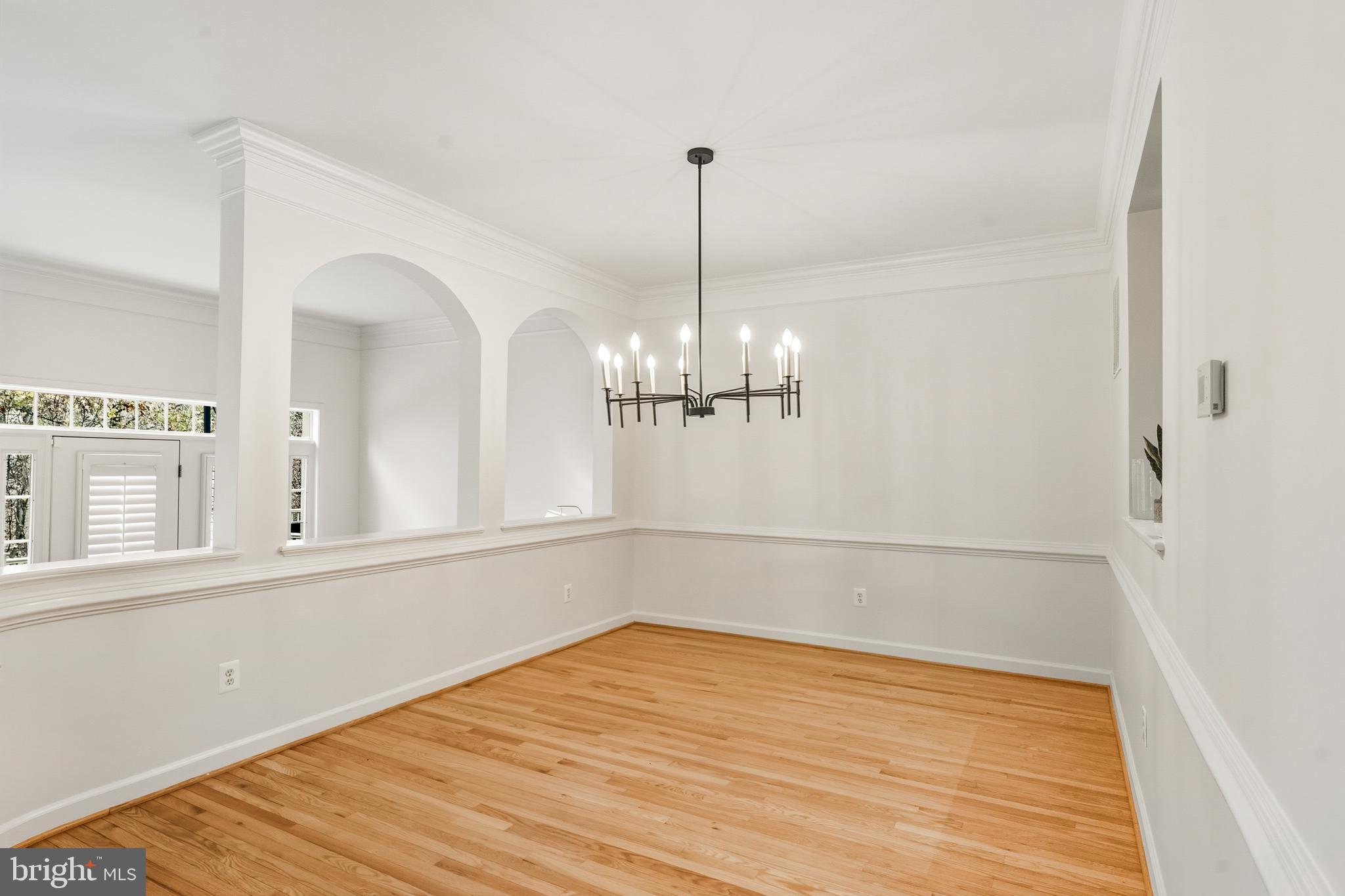 1919 Logan Manor Drive Reston, VA 20190 - Photo 5 of 57 a view of a room with wooden floor and a window