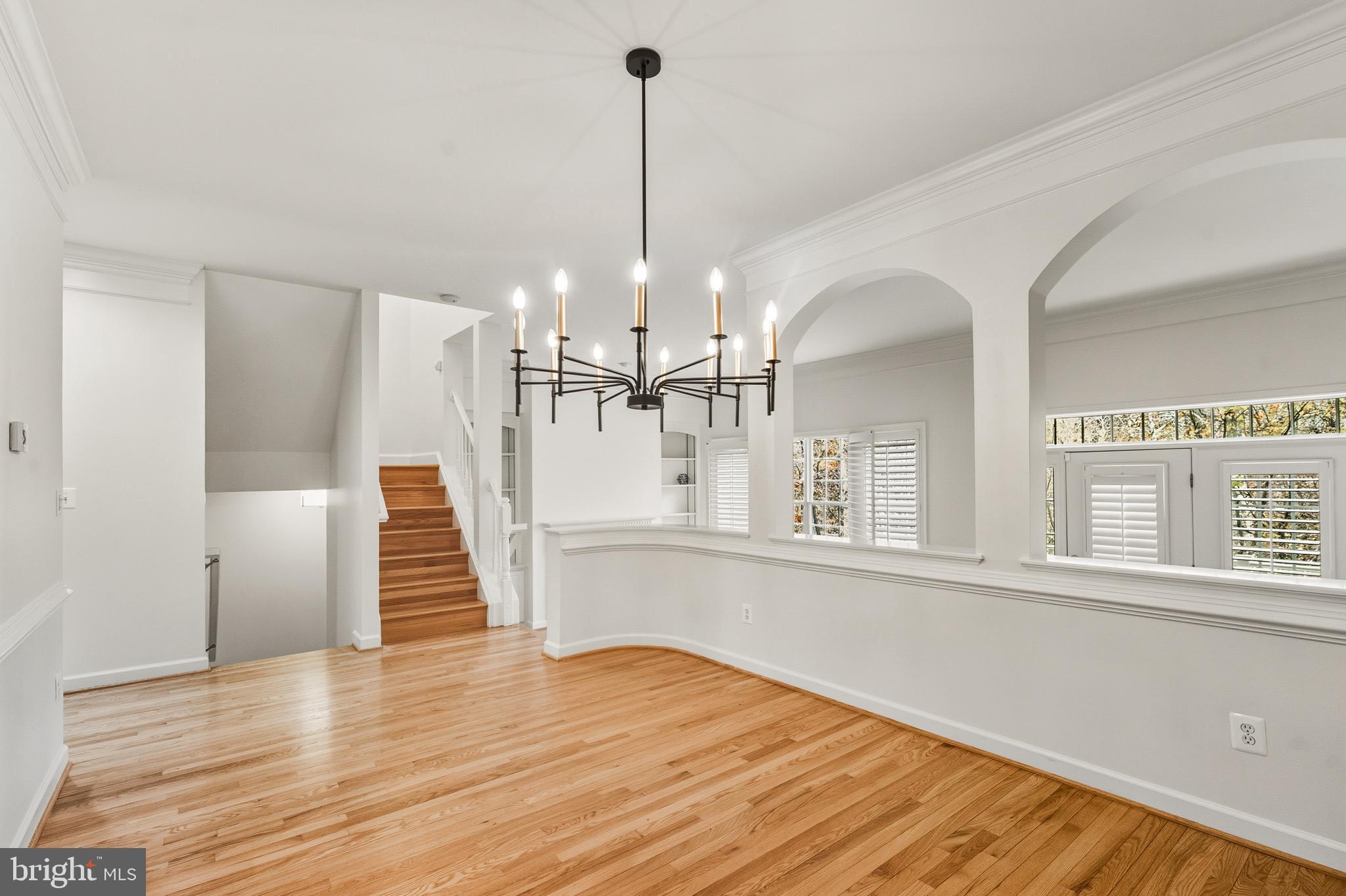 1919 Logan Manor Drive Reston, VA 20190 - Photo 6 of 57 a view of a room with wooden floor and staircase