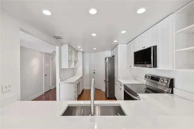 a view of a living room and a flat screen tv