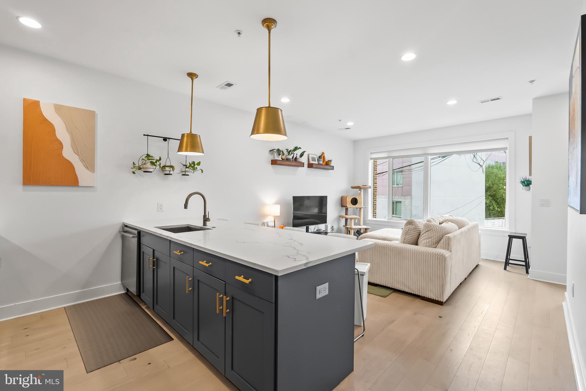 a view of living room with furniture and a chandelier