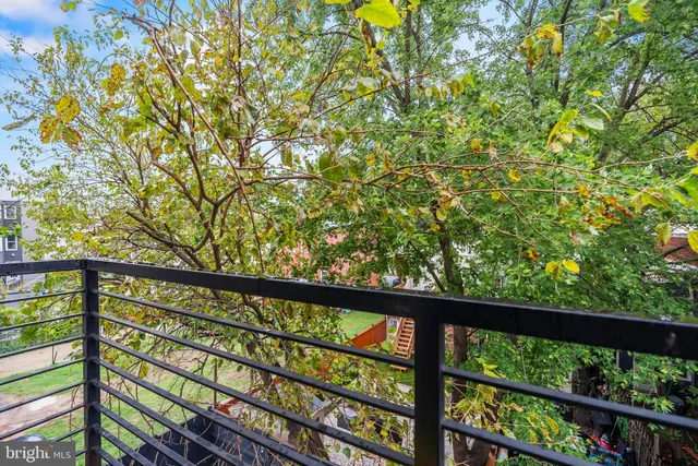 a view of a balcony with a pot