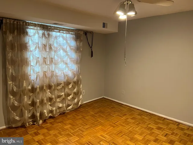 a bathroom with a shower curtain and a shower curtain