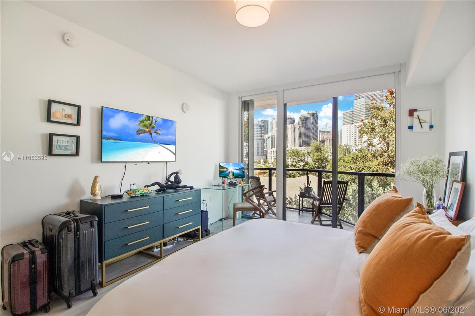 201 Southwest 17th Road, Unit 511 Miami, FL 33129 - Photo 12 of 16 a bedroom with furniture and a large window