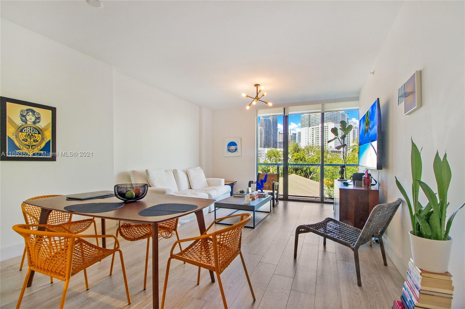 201 Southwest 17th Road, Unit 511 Miami, FL 33129 - Photo 5 of 16 a view of a livingroom with furniture and a potted plant