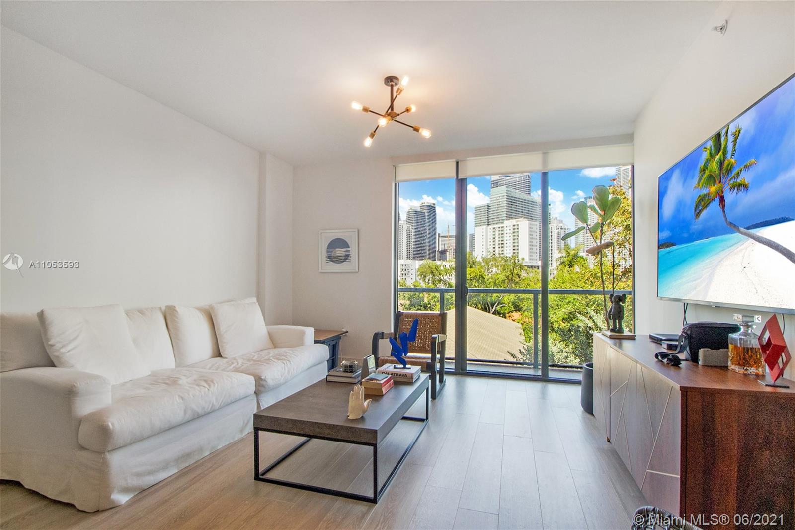 201 Southwest 17th Road, Unit 511 Miami, FL 33129 - Photo 6 of 16 a living room with furniture and a large window
