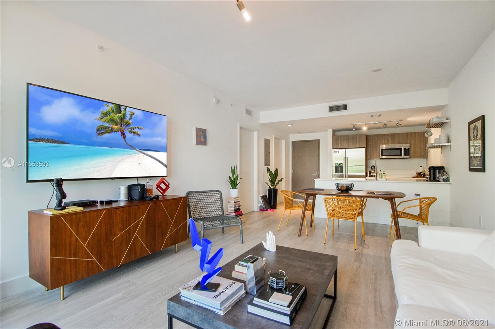 201 Southwest 17th Road, Unit 511 Miami, FL 33129 - Photo 7 of 16 a living room with furniture a rug and a lamp
