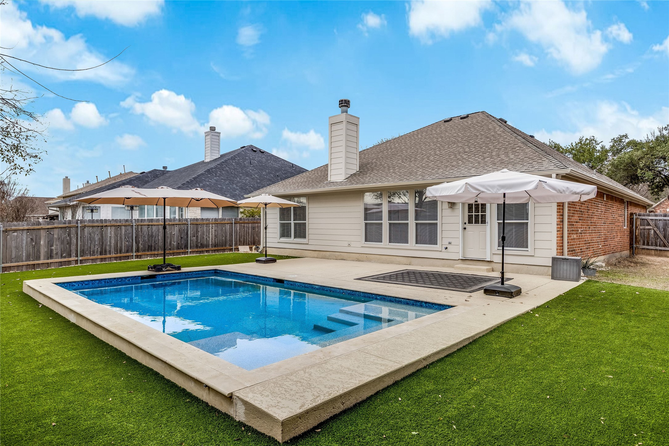 4319 South Summercrest Loop Round Rock, TX 78681 - Photo 2 of 35 a view of a house with swimming pool and sitting area