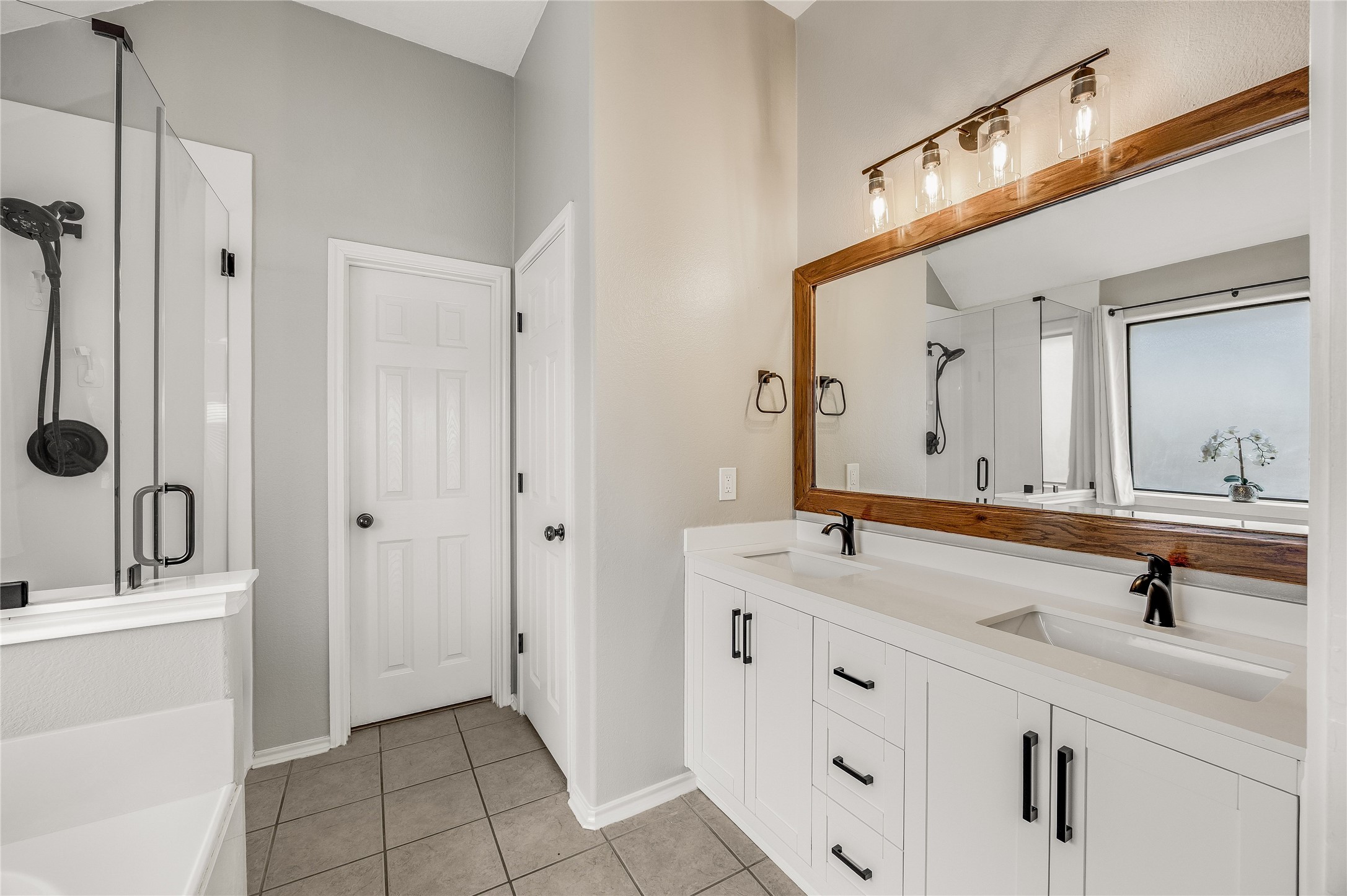 4319 South Summercrest Loop Round Rock, TX 78681 - Photo 25 of 35 a bathroom with a double vanity sink mirror and