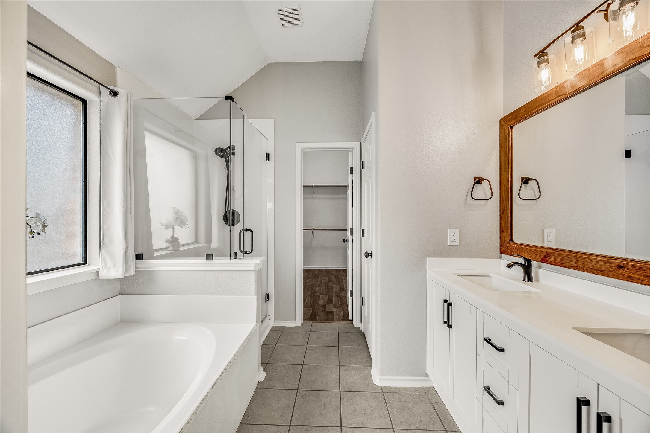 4319 South Summercrest Loop Round Rock, TX 78681 - Photo 27 of 35 a bathroom with a tub sink and a mirror