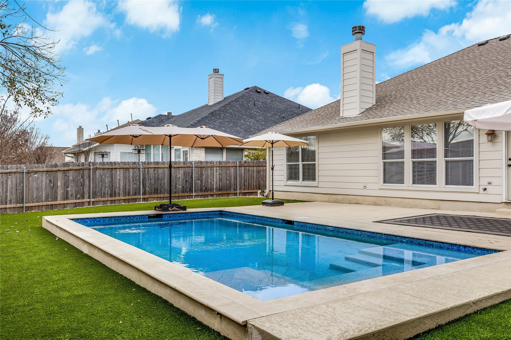 4319 South Summercrest Loop Round Rock, TX 78681 - Photo 6 of 35 a view of a house with pool and chairs