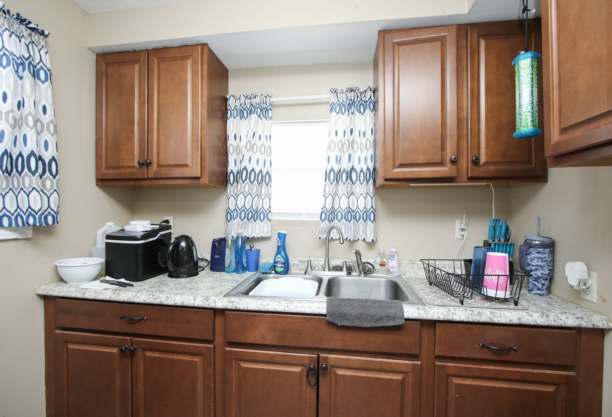 7610 Moore Road Pattison, TX 77423 - Photo 12 of 40 a kitchen with granite countertop a sink stainless steel appliances and cabinets