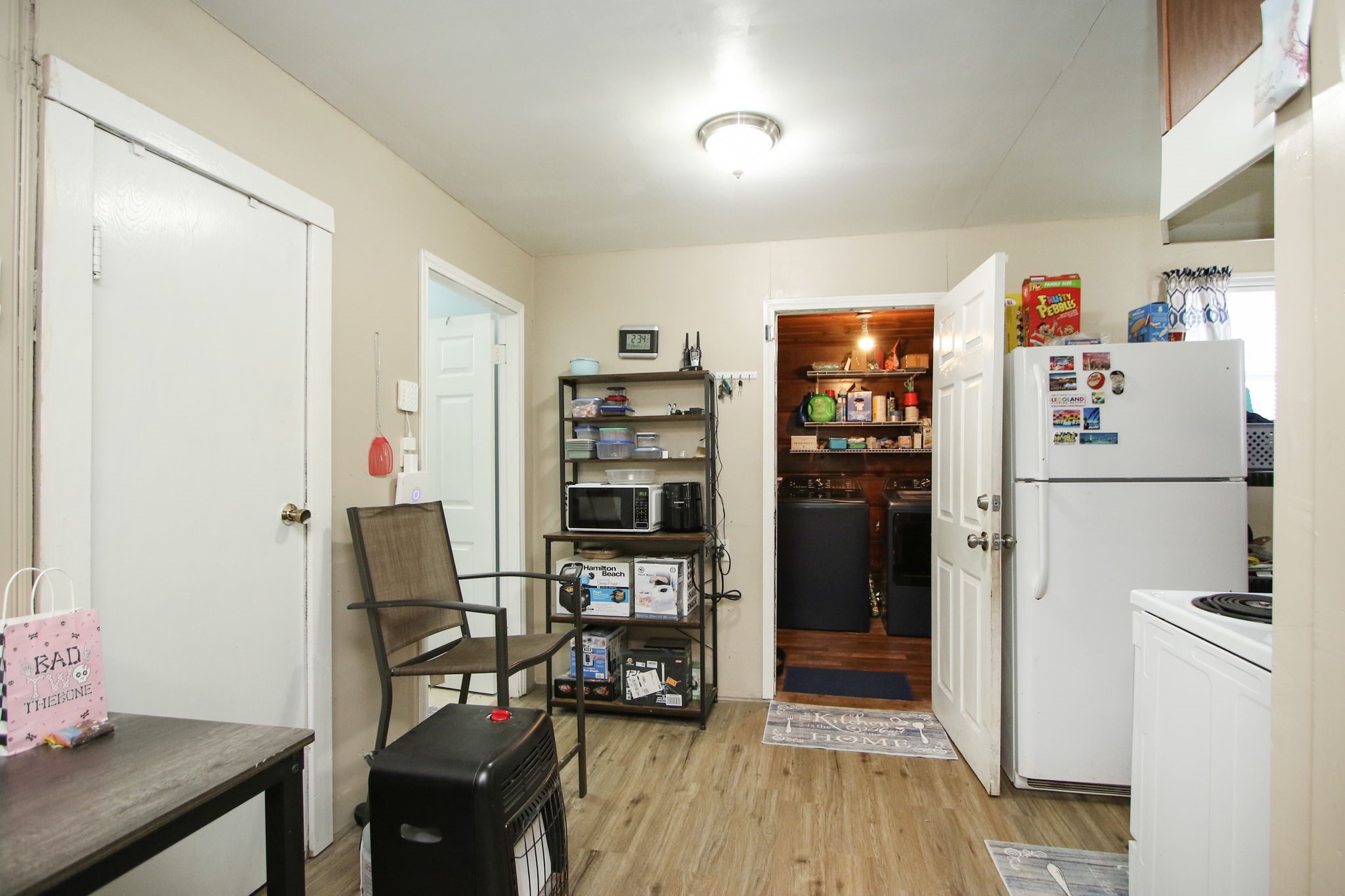 7610 Moore Road Pattison, TX 77423 - Photo 13 of 40 a kitchen with refrigerator and cabinets