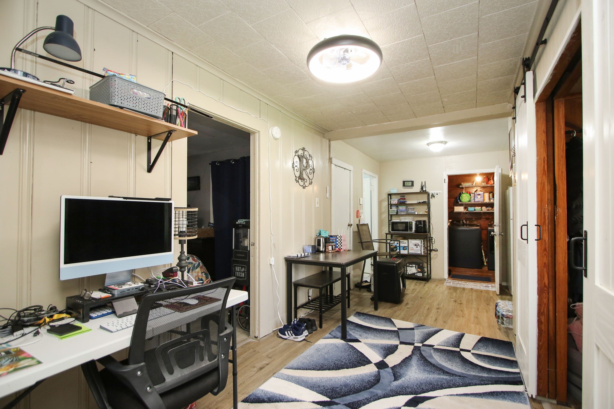 7610 Moore Road Pattison, TX 77423 - Photo 14 of 40 a living room with furniture and a flat screen tv