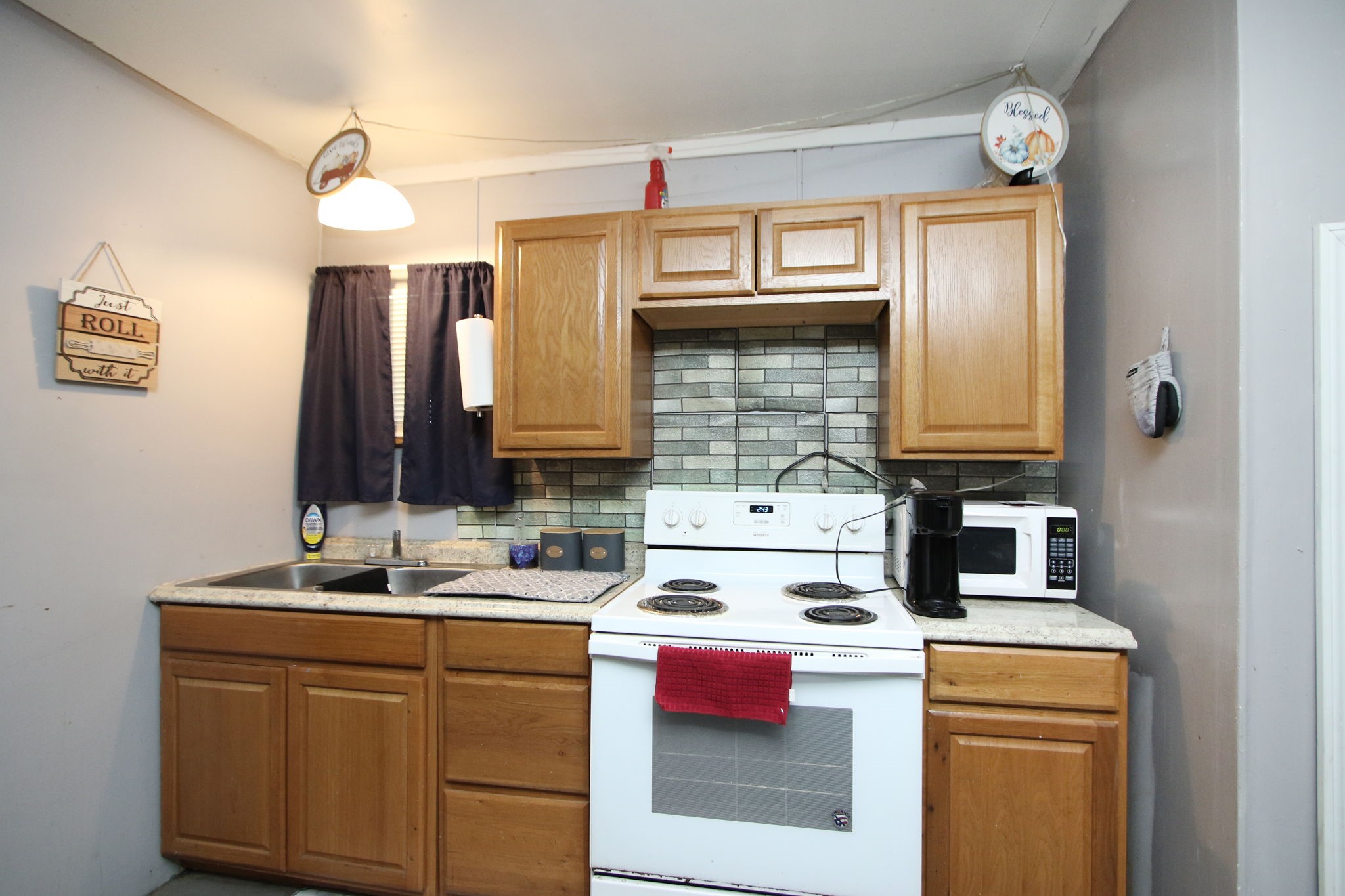 7610 Moore Road Pattison, TX 77423 - Photo 28 of 40 a kitchen with a sink cabinets and appliances